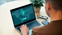 A man enabling a vpn on his computer