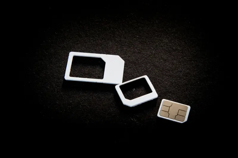 A phone sim card on a black background